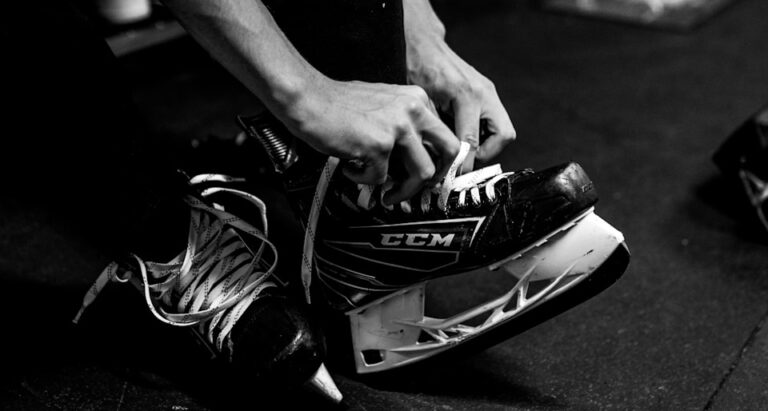 person wearing pair of ice skates