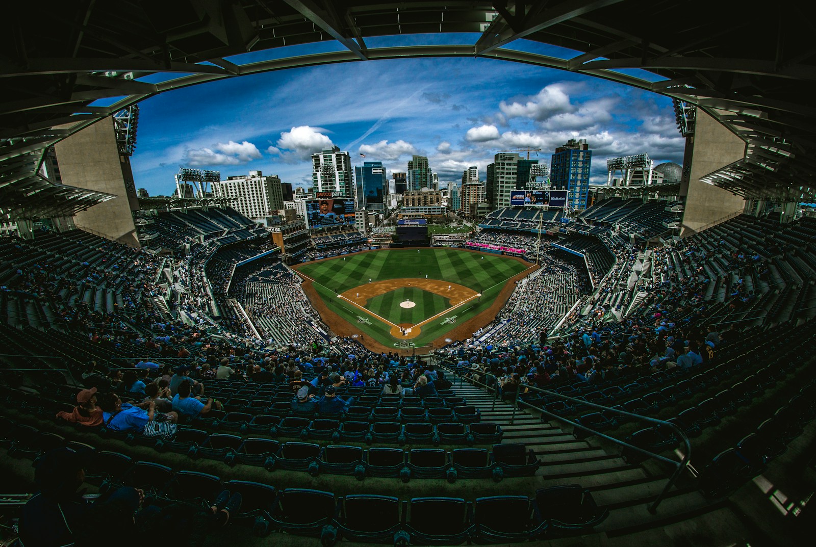 Photo by Derek Story aerial photography of ballpark stadium surrounded by crowd of people