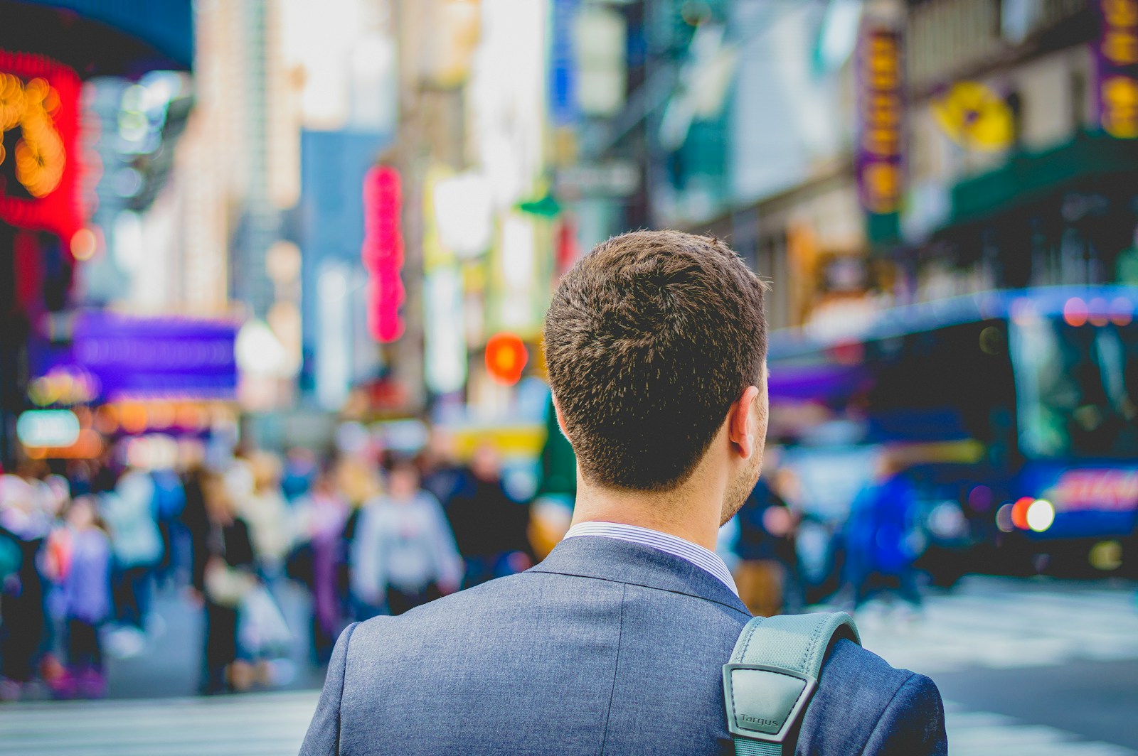 Photo by Saulo Mohana shallow focus photography of man in suit jacket's back