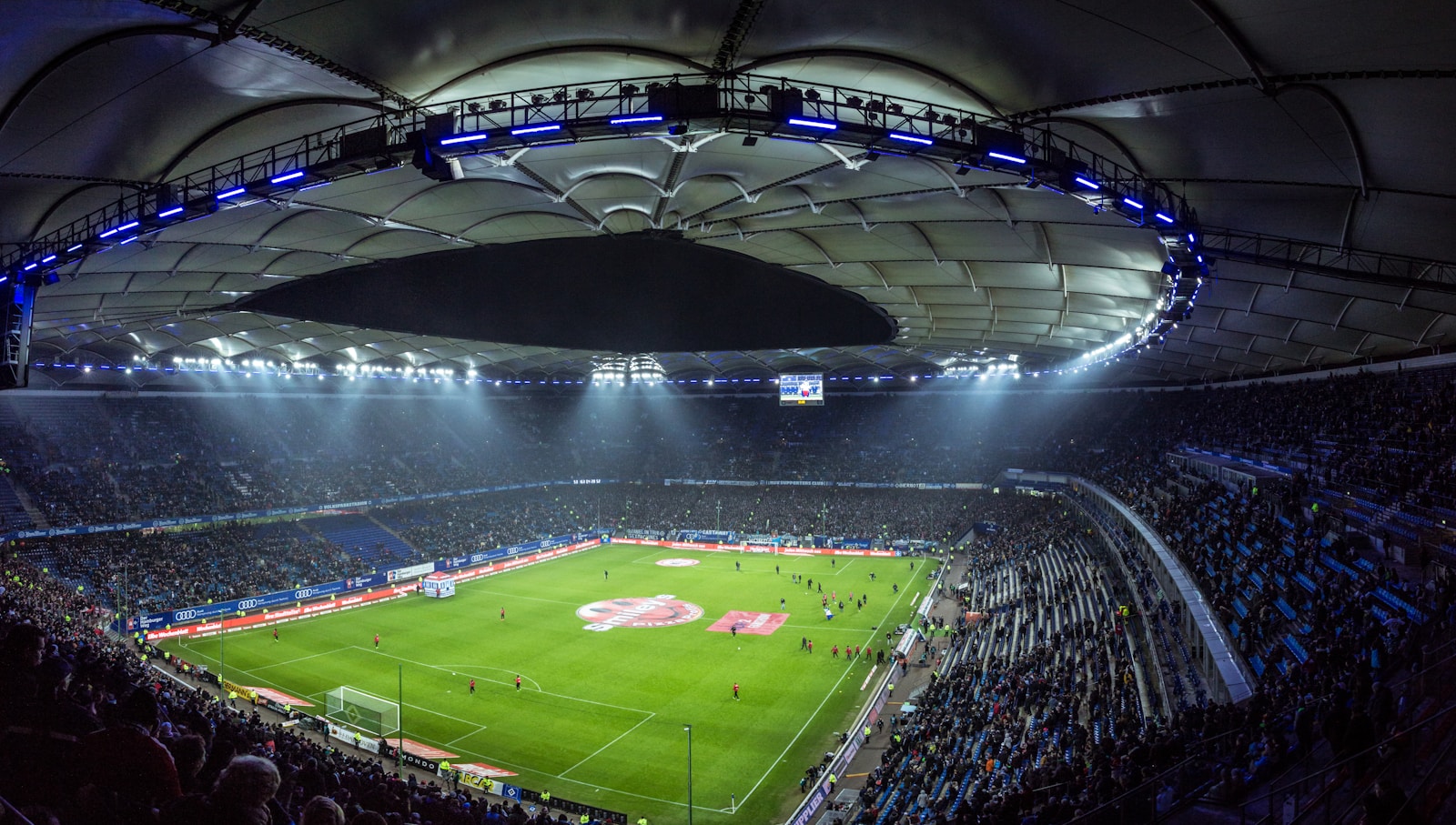 Photo by Mario Klassen high angel photography of football stadium