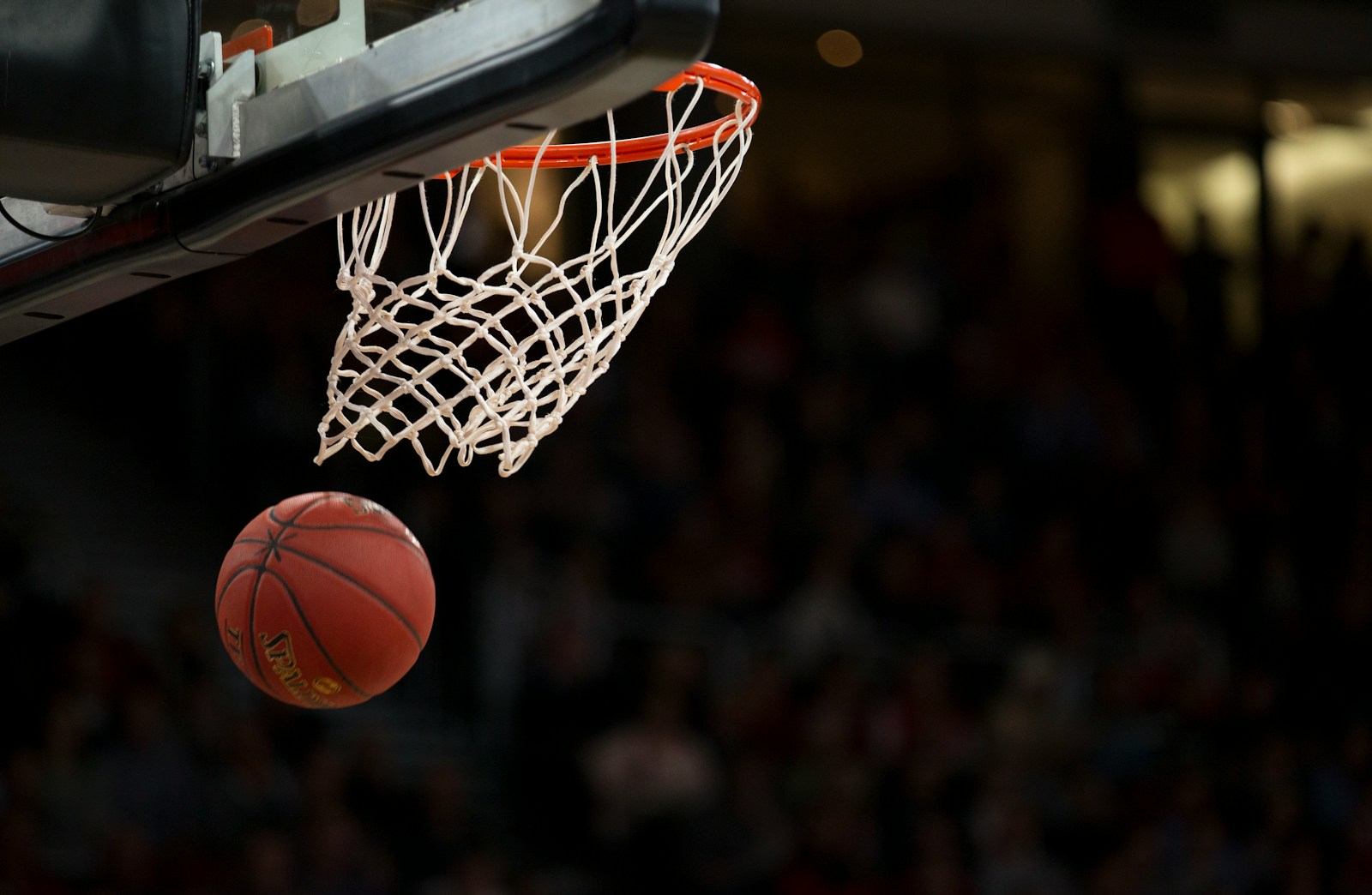 Photo by Markus Spiske ball under basketball ring