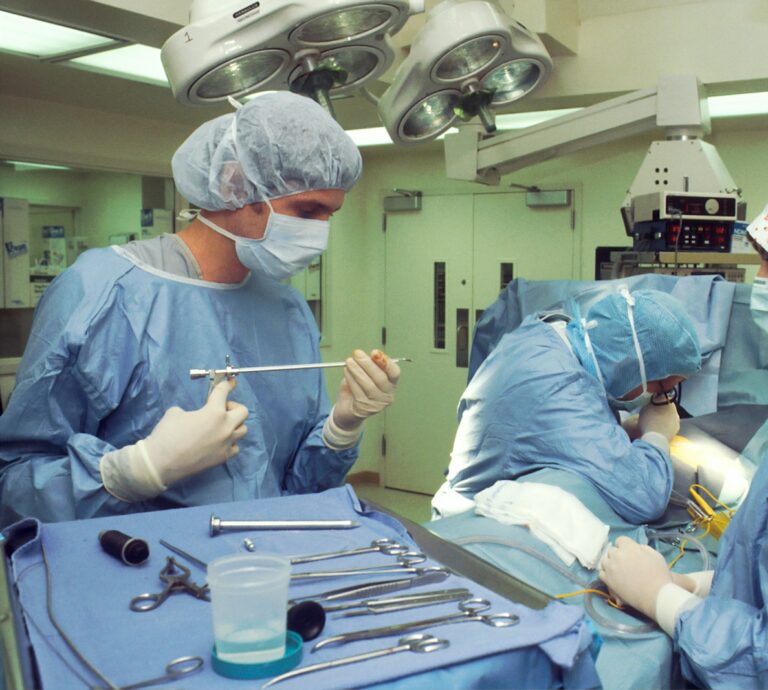 people in blue scrub suit sitting on chair