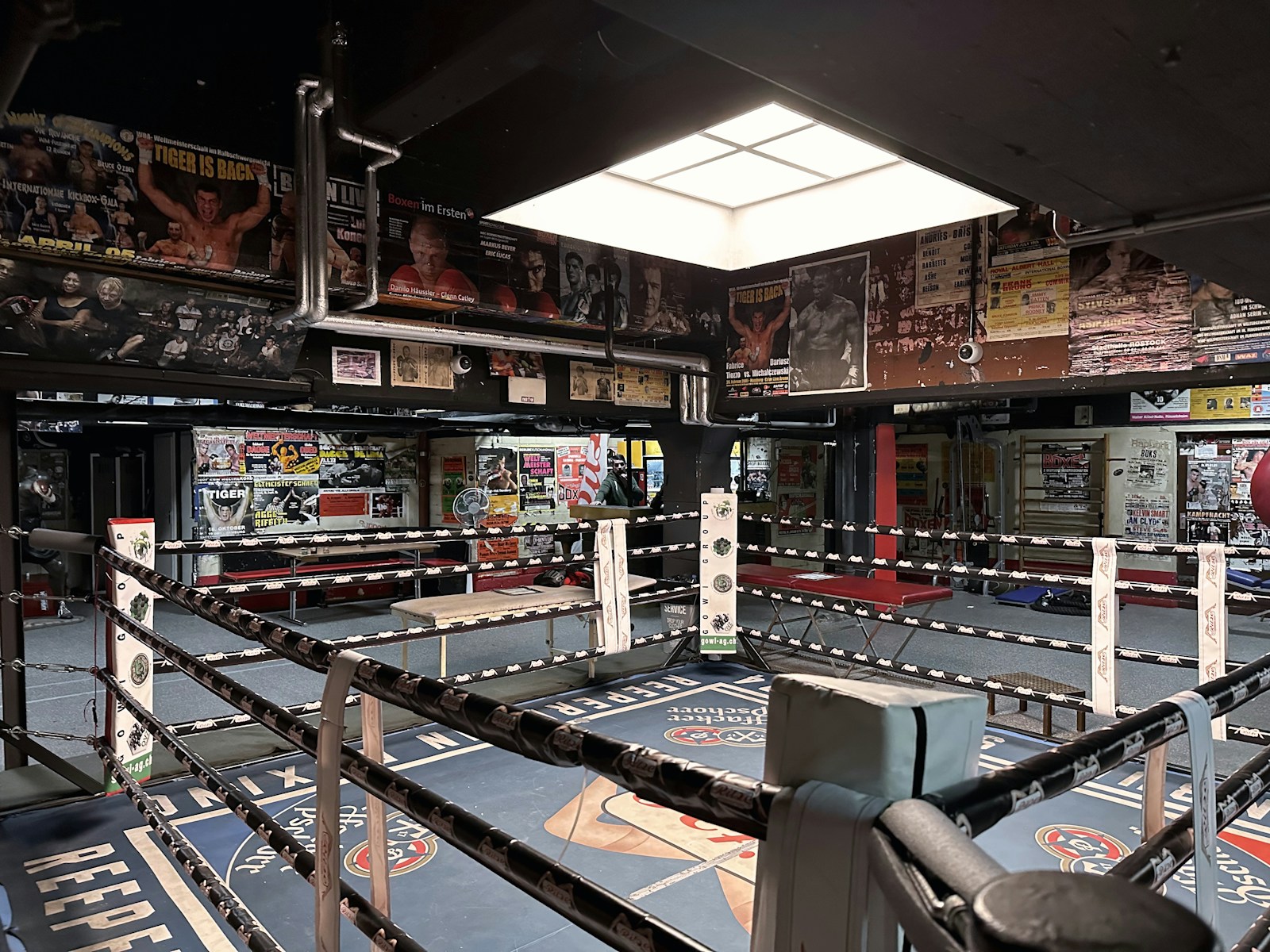 Photo by Rikin Katyal a large room with many signs and a large metal object in it