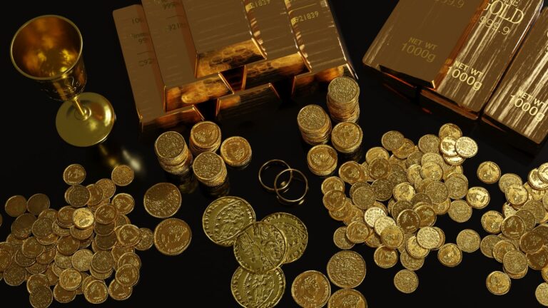 a table topped with lots of gold coins