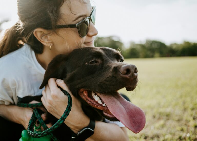 woman hugging a dog