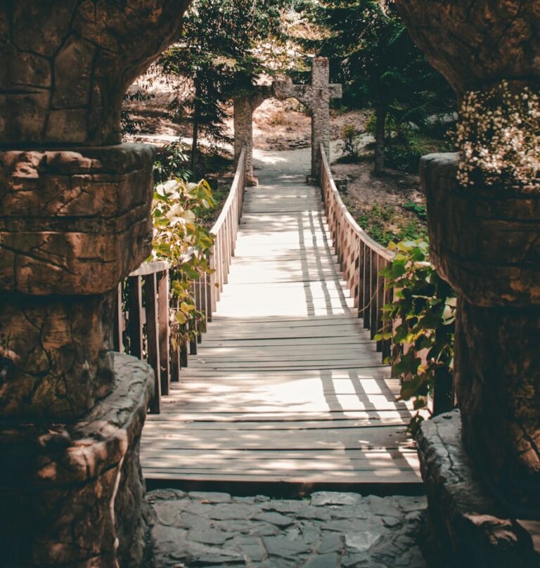 A stone bridge with a walkway going through it